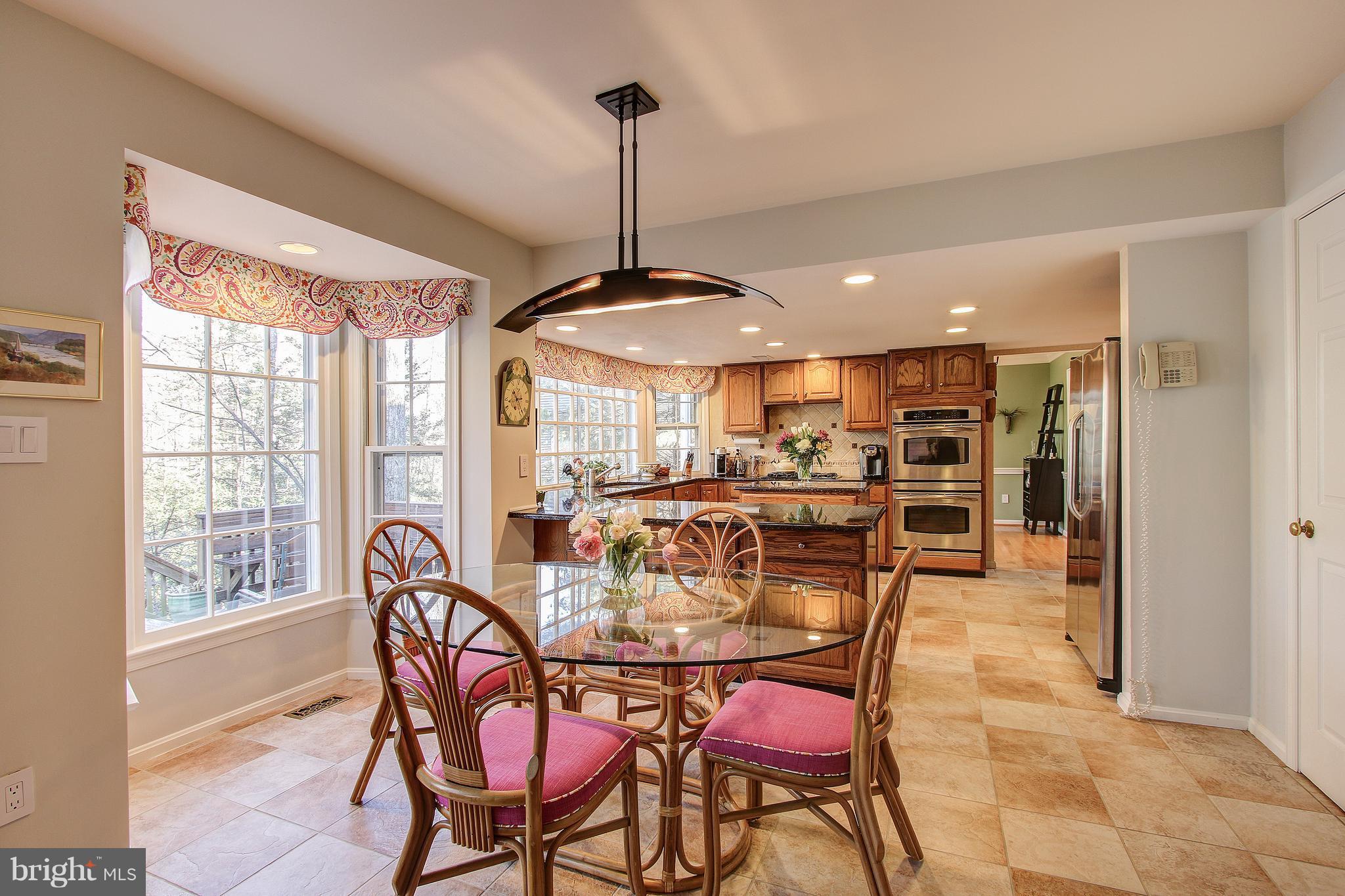 11898 Fawn Ridge Lane Reston, VA 20194 - Photo 9 of 30 Breakfast Room overlooks deck and back yard!