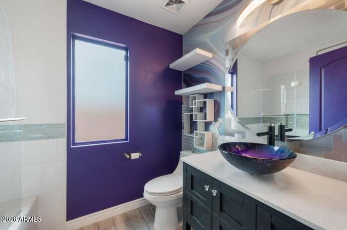 4130 East Chambers Street Phoenix, AZ 85040 - Photo 16 of 21 a kitchen with granite countertop a sink dishwasher and a toilet
