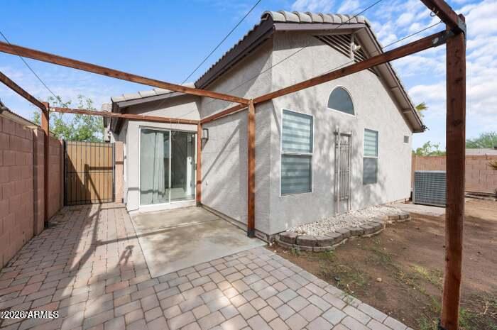 4130 East Chambers Street Phoenix, AZ 85040 - Photo 20 of 21 a view of a house with a street