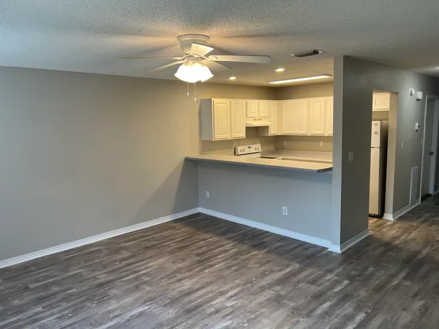 a view of a kitchen from the hallway