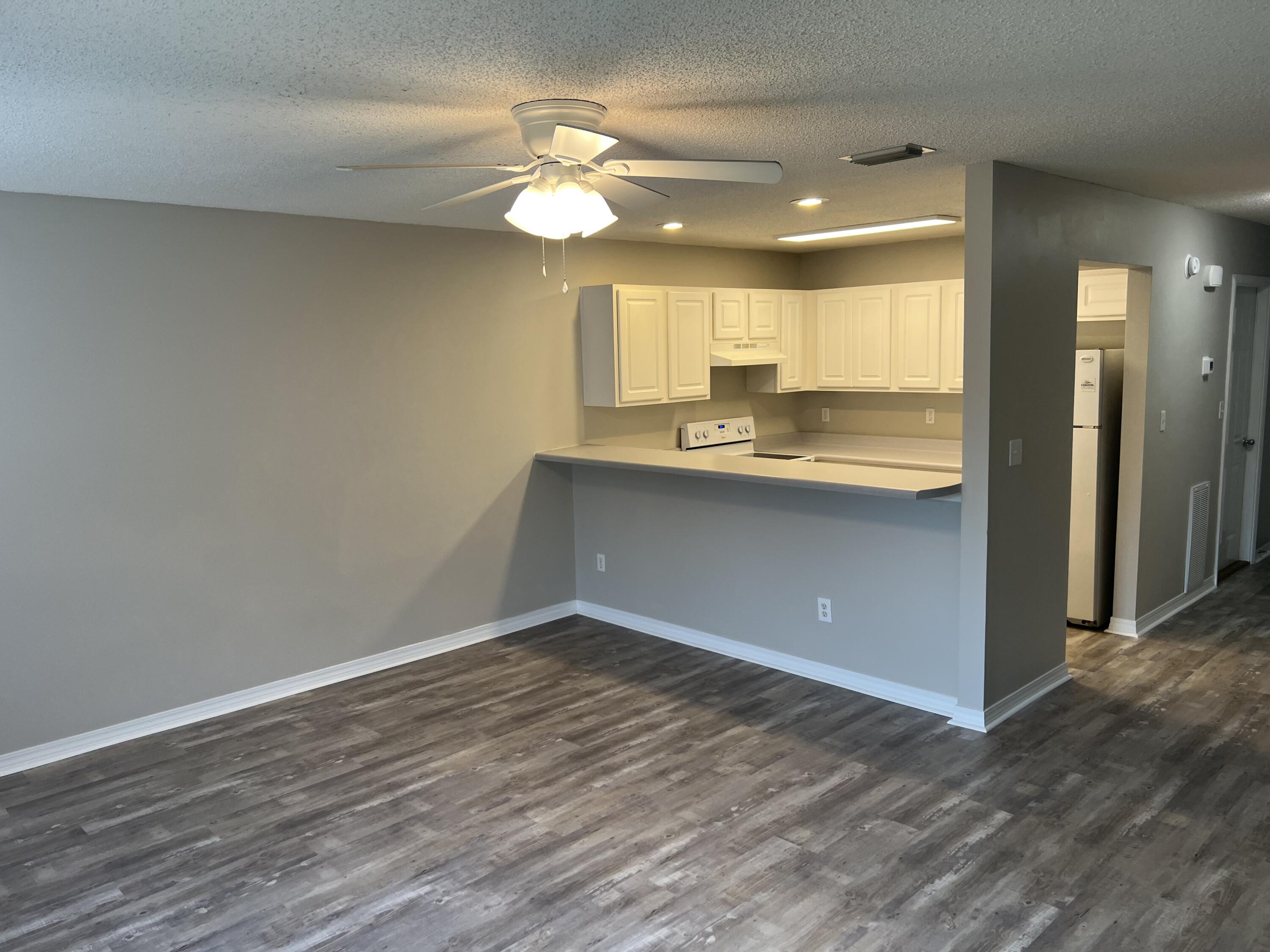 2263 Whitman Lane Fort Walton Beach, FL 32547 - Photo 2 of 7 a view of a kitchen from the hallway