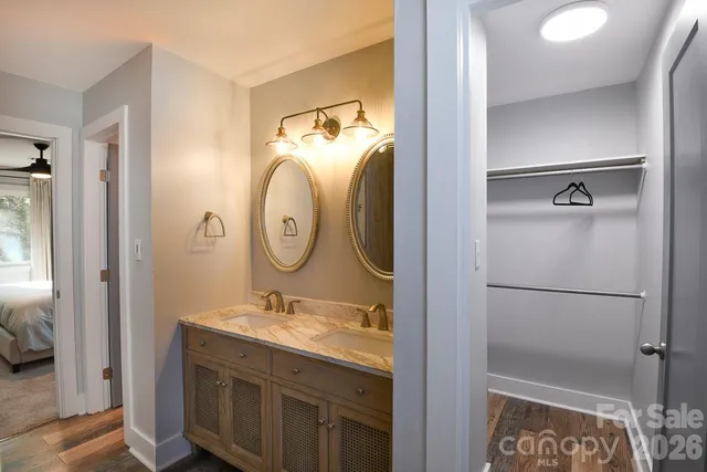 a bathroom with a mirror sink and shower