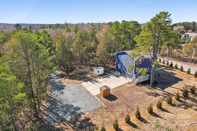 a view of a backyard with sitting area