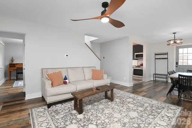 a living room with furniture and a rug