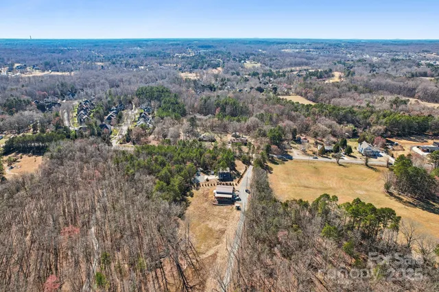 an aerial view of residential building and lake