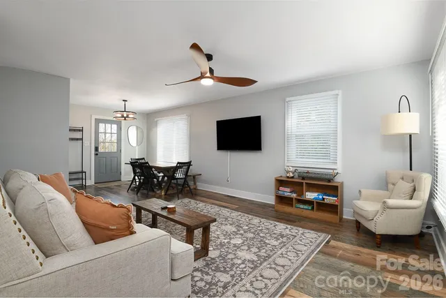 a living room with furniture and a flat screen tv