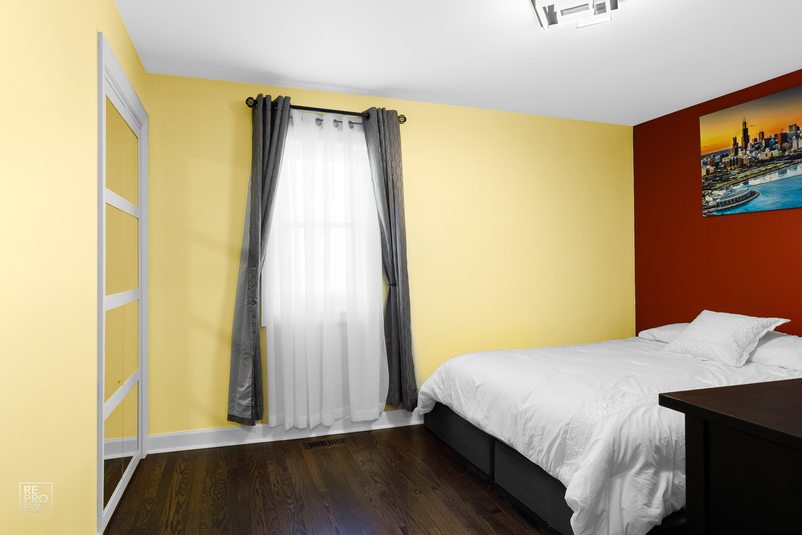 310 West Rand Road Mount Prospect, IL 60056 - Photo 14 of 26 a bedroom with a bed and wooden floor