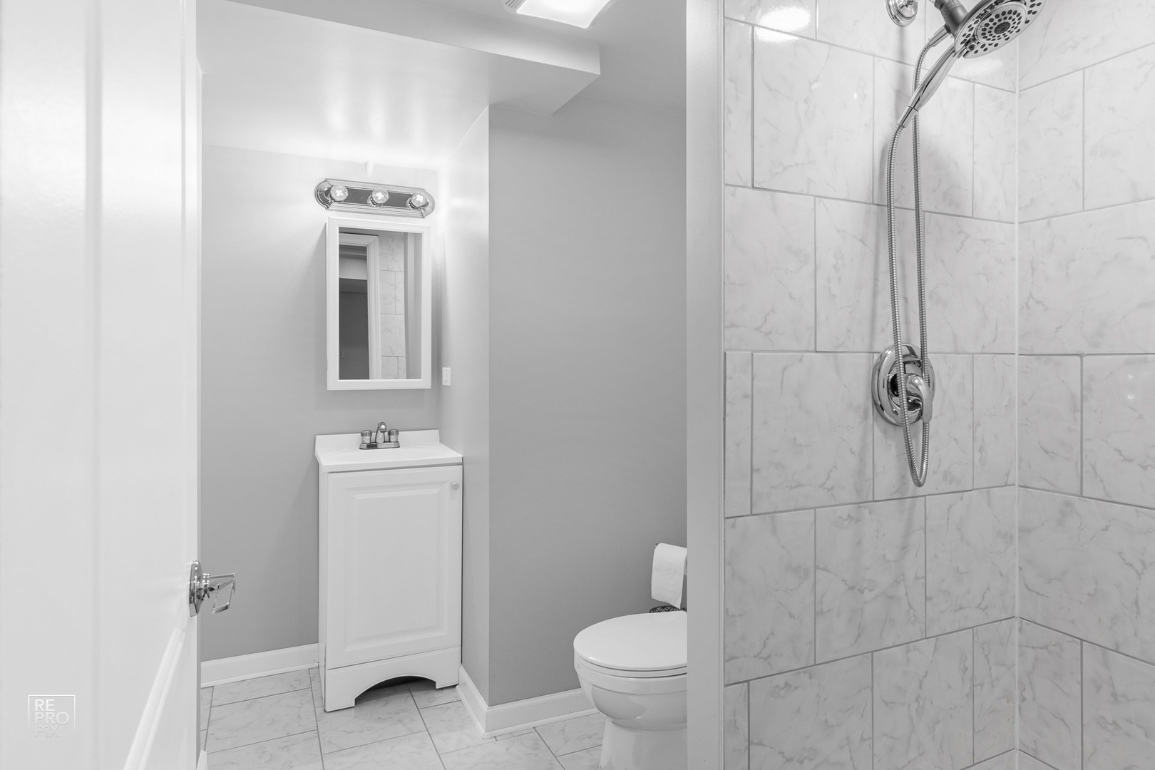 310 West Rand Road Mount Prospect, IL 60056 - Photo 19 of 26 a bathroom with a toilet sink and shower