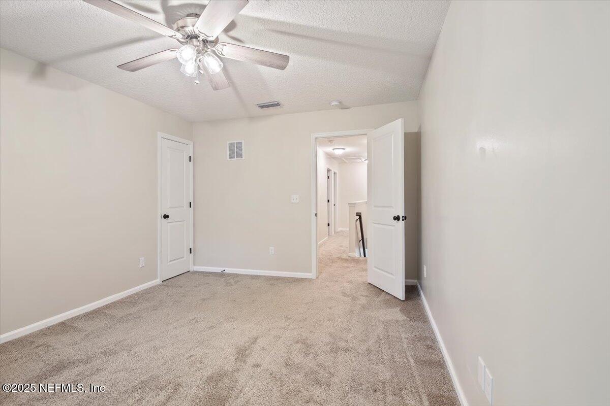 4182 Quiet Crk Loop Middleburg, FL 32068 - Photo 13 of 30 wooden floor in an empty room