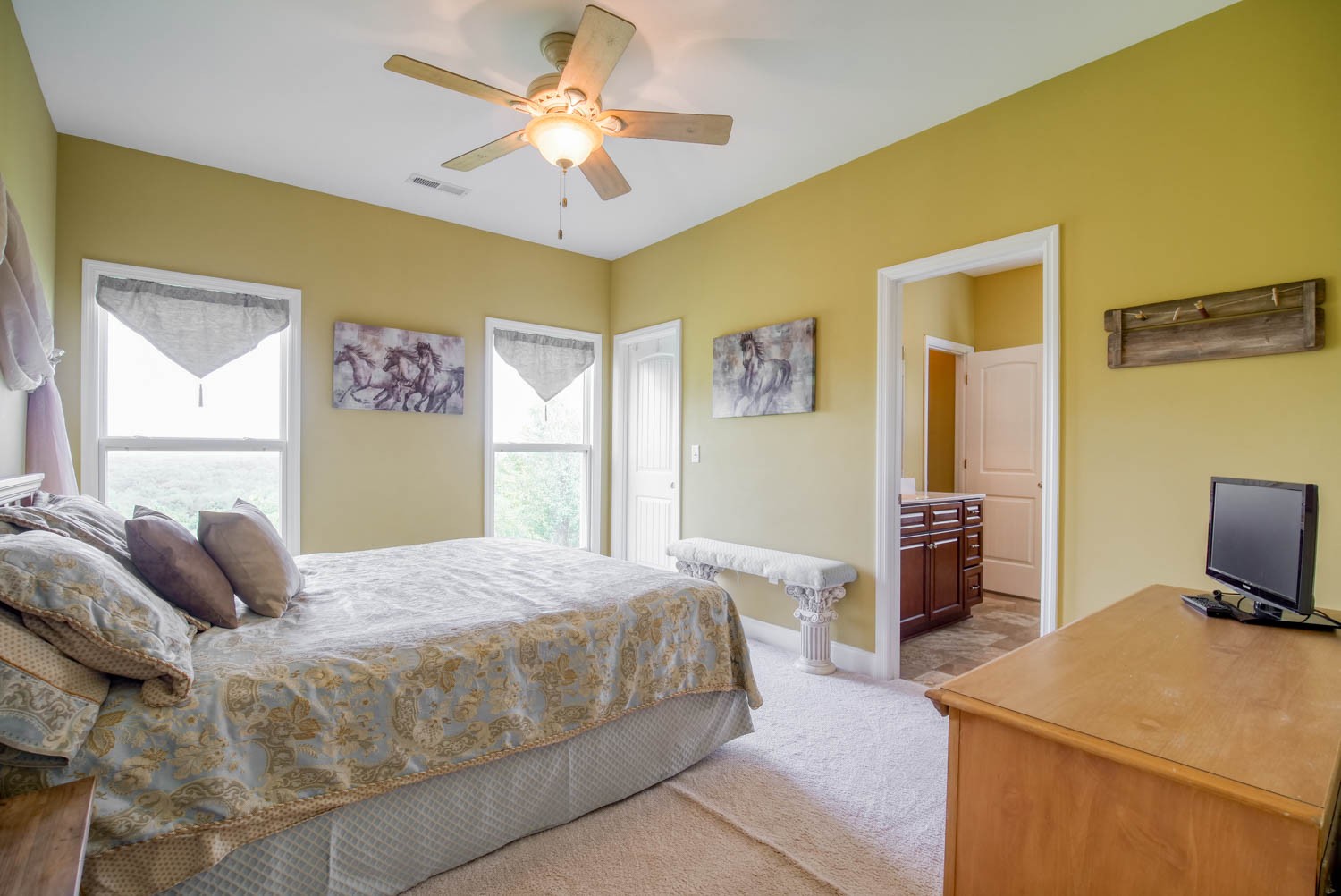 5088 Franklin Road Lebanon, TN 37090 - Photo 33 of 44 a bedroom with a bed and a chandelier