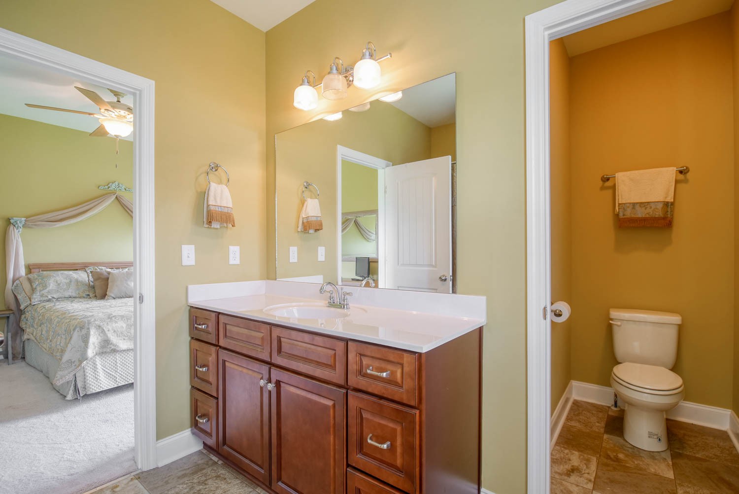5088 Franklin Road Lebanon, TN 37090 - Photo 34 of 44 a bathroom with a granite countertop sink a toilet and a mirror
