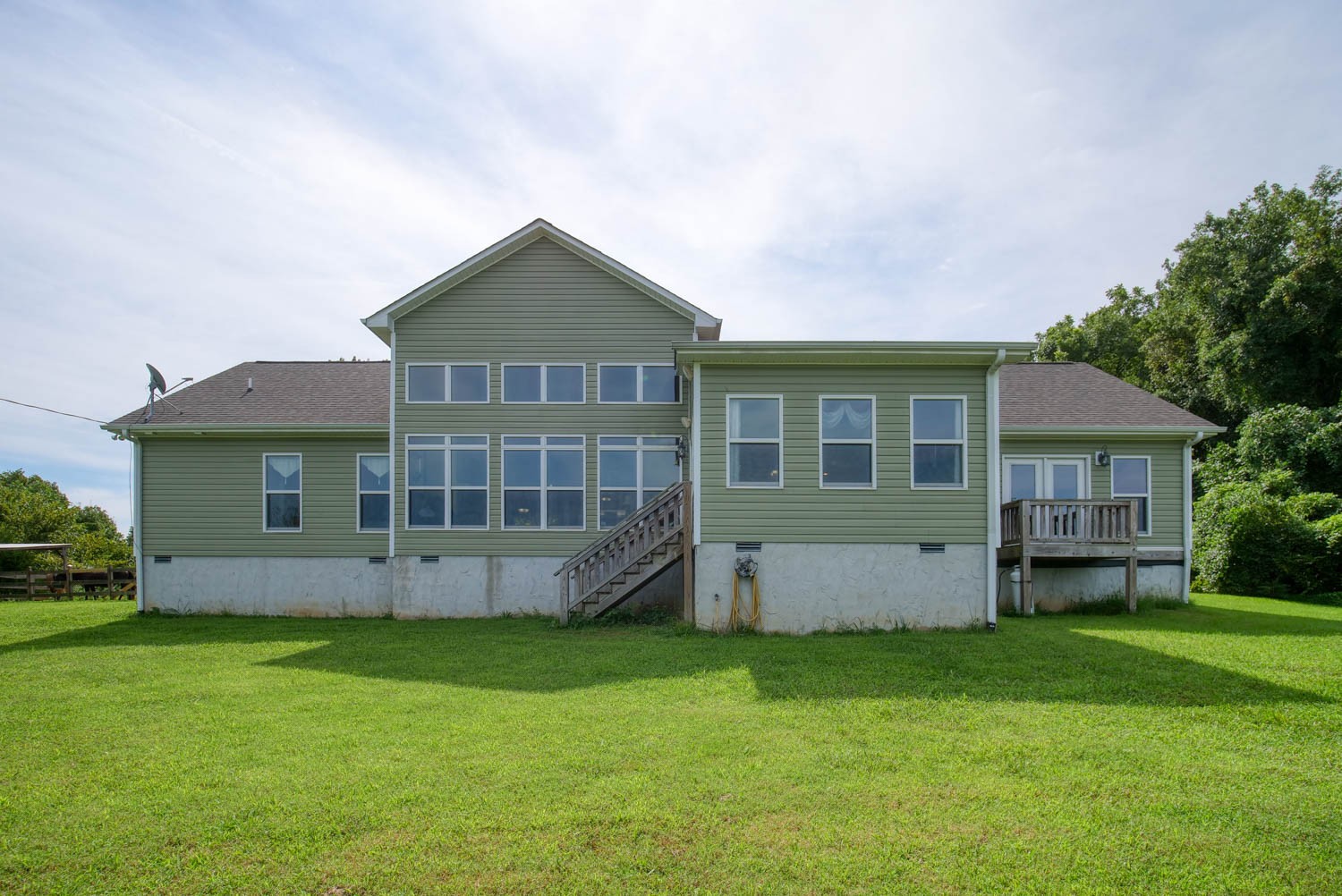 5088 Franklin Road Lebanon, TN 37090 - Photo 8 of 44 a front view of a house with a garden and yard