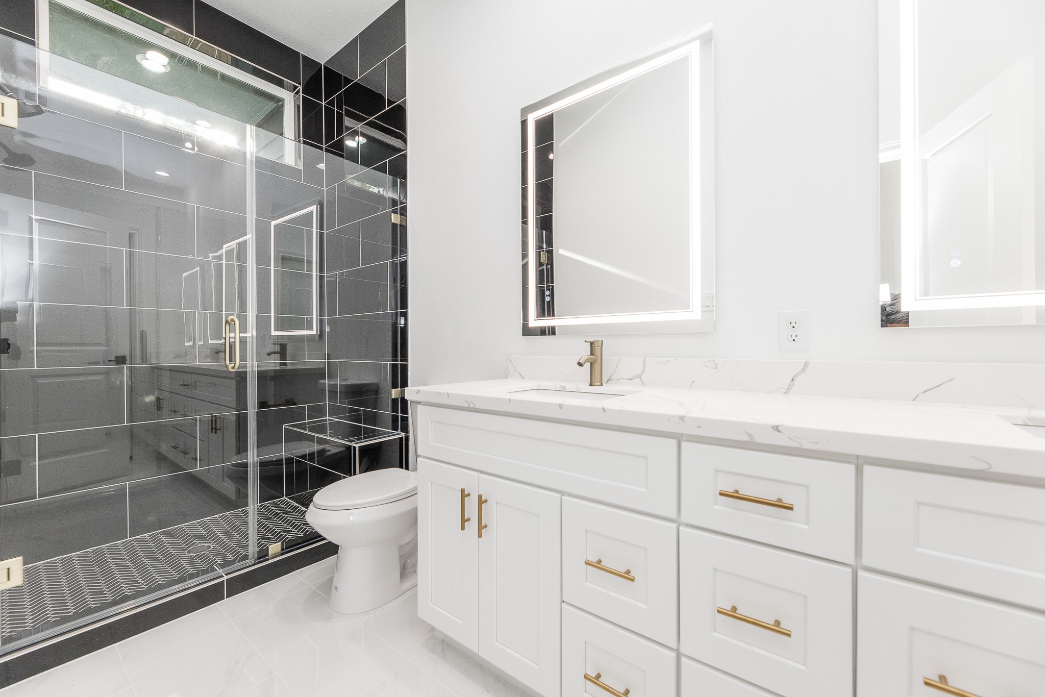 8502 Safeguard Street, Unit B Houston, TX 77051 - Photo 18 of 26 a bathroom with a shower sink and mirror
