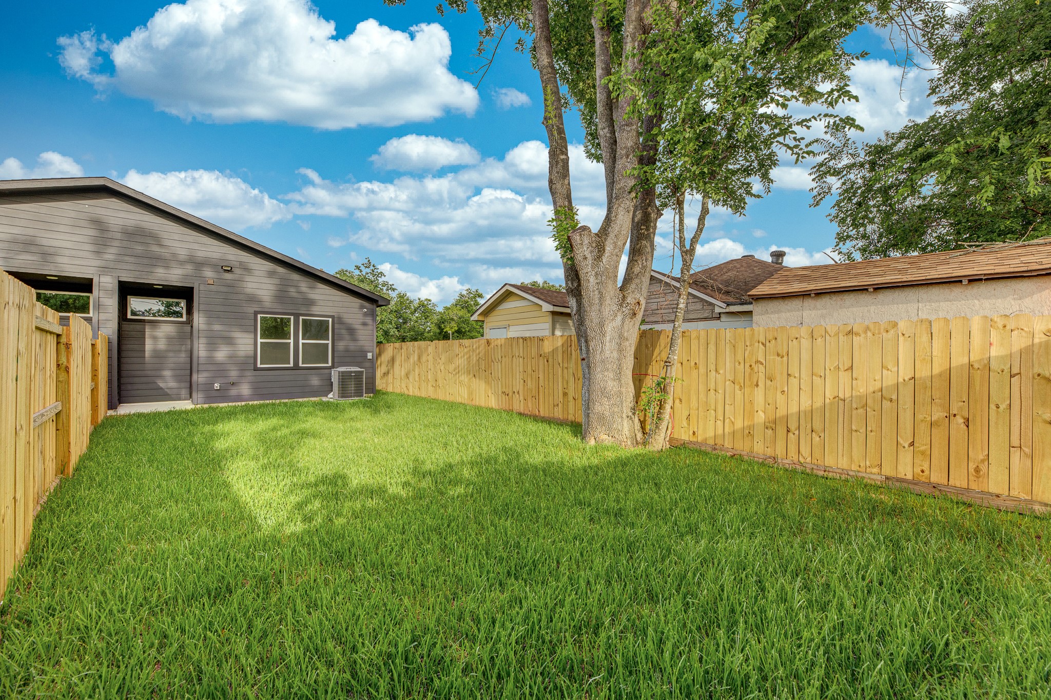 8502 Safeguard Street, Unit B Houston, TX 77051 - Photo 26 of 26 a view of a backyard with a large tree