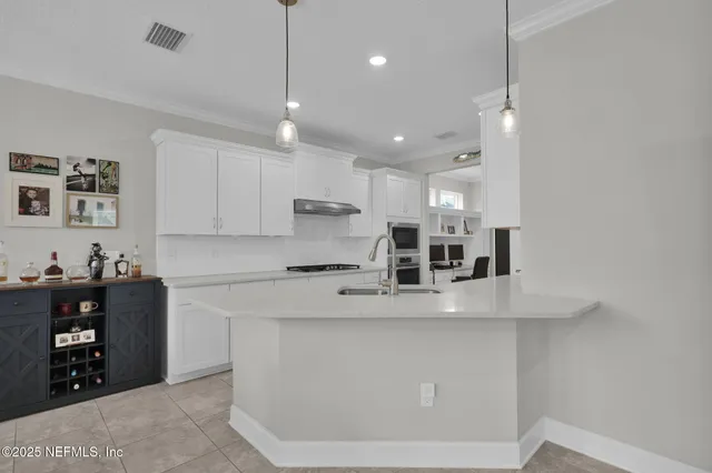 a view of a patio with table and chairs