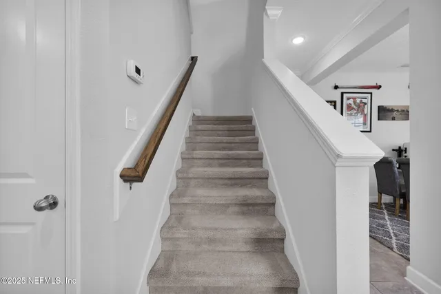 a bathroom with a sink a light fixture and a mirror