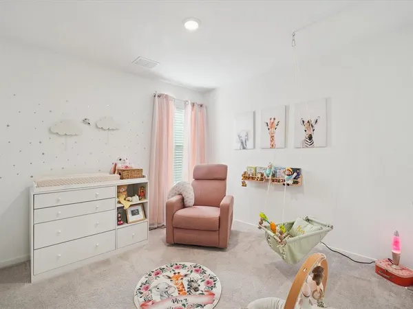 a living room with furniture and a table