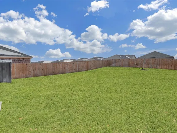 a view of a backyard with garden
