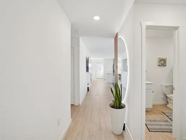 a close view of walk in closet and living room