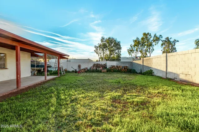 a view of an house with backyard space and garden