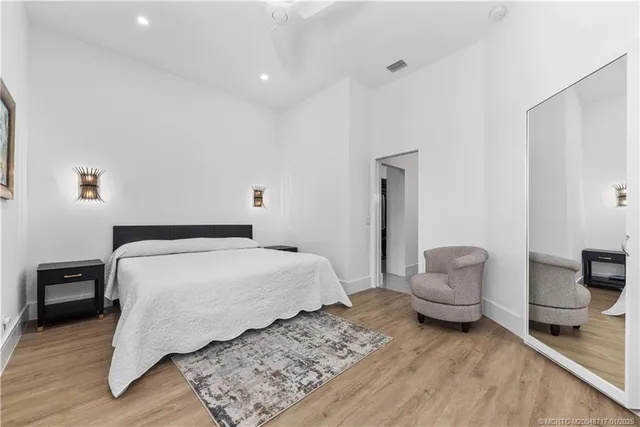 a bedroom with a bed and a chair