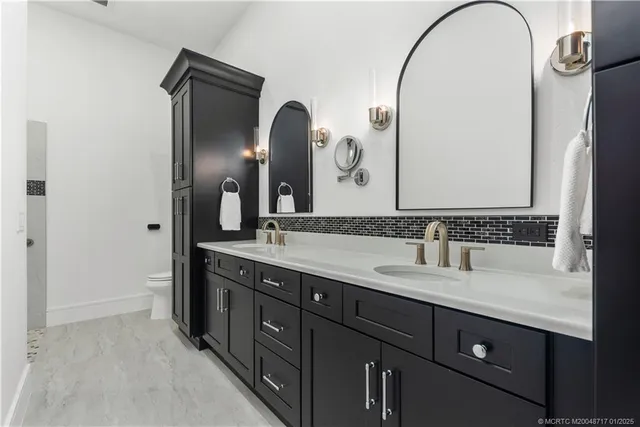 a bedroom with a bed and a view of bathroom