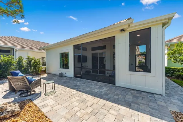 a view of a backyard with sitting area
