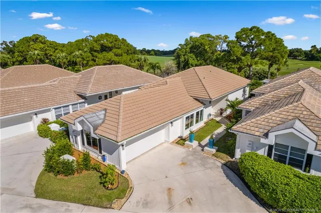 an aerial view of a house with a garden