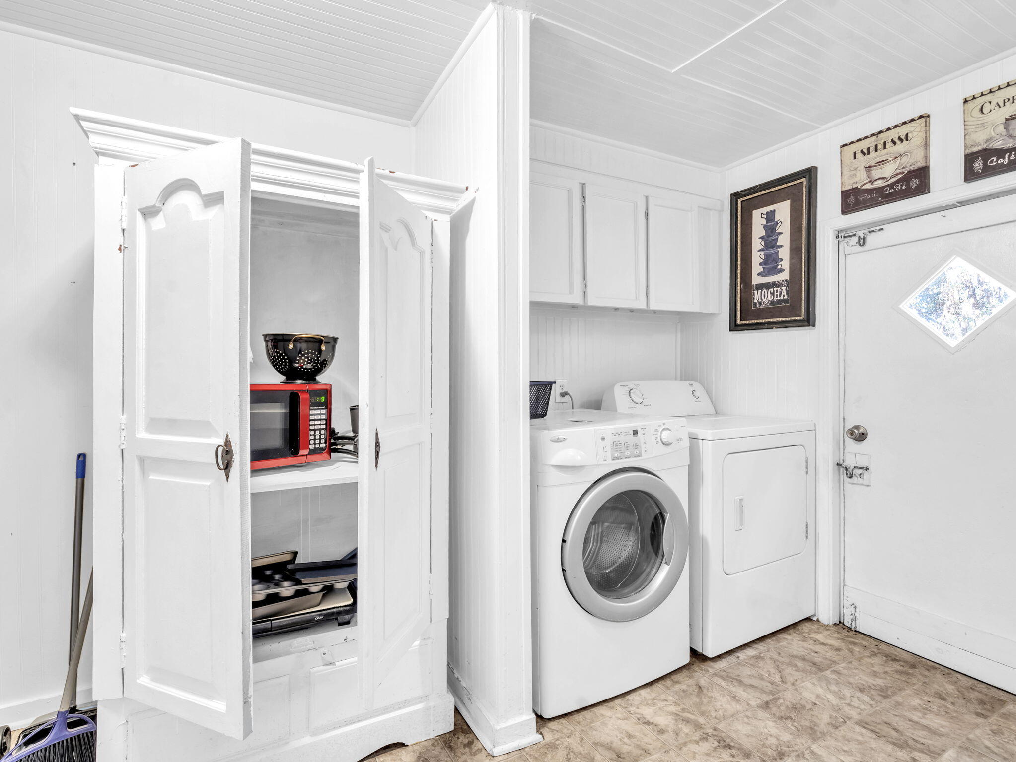 9028 Larker Woods Road Navarre, FL 32566 - Photo 12 of 36 a utility room with sink dryer and washer