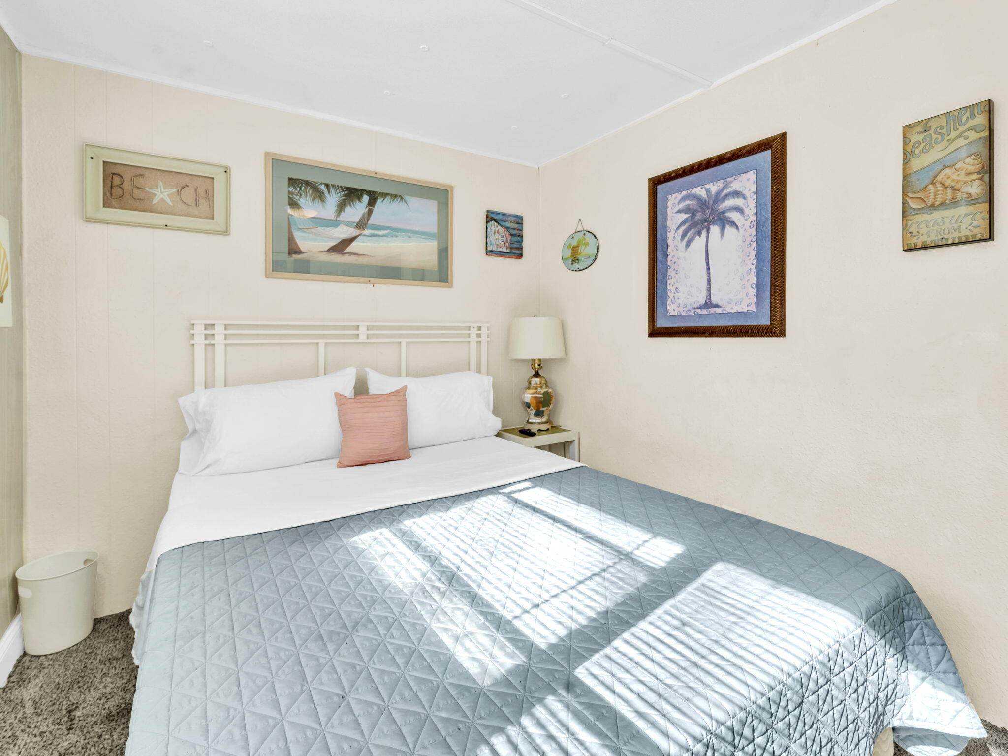 9028 Larker Woods Road Navarre, FL 32566 - Photo 17 of 36 a bedroom with a large bed and a couch