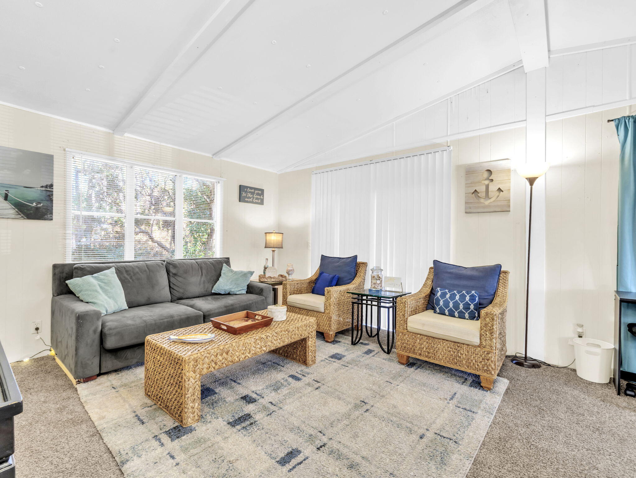 9028 Larker Woods Road Navarre, FL 32566 - Photo 2 of 36 a living room with furniture and a couch