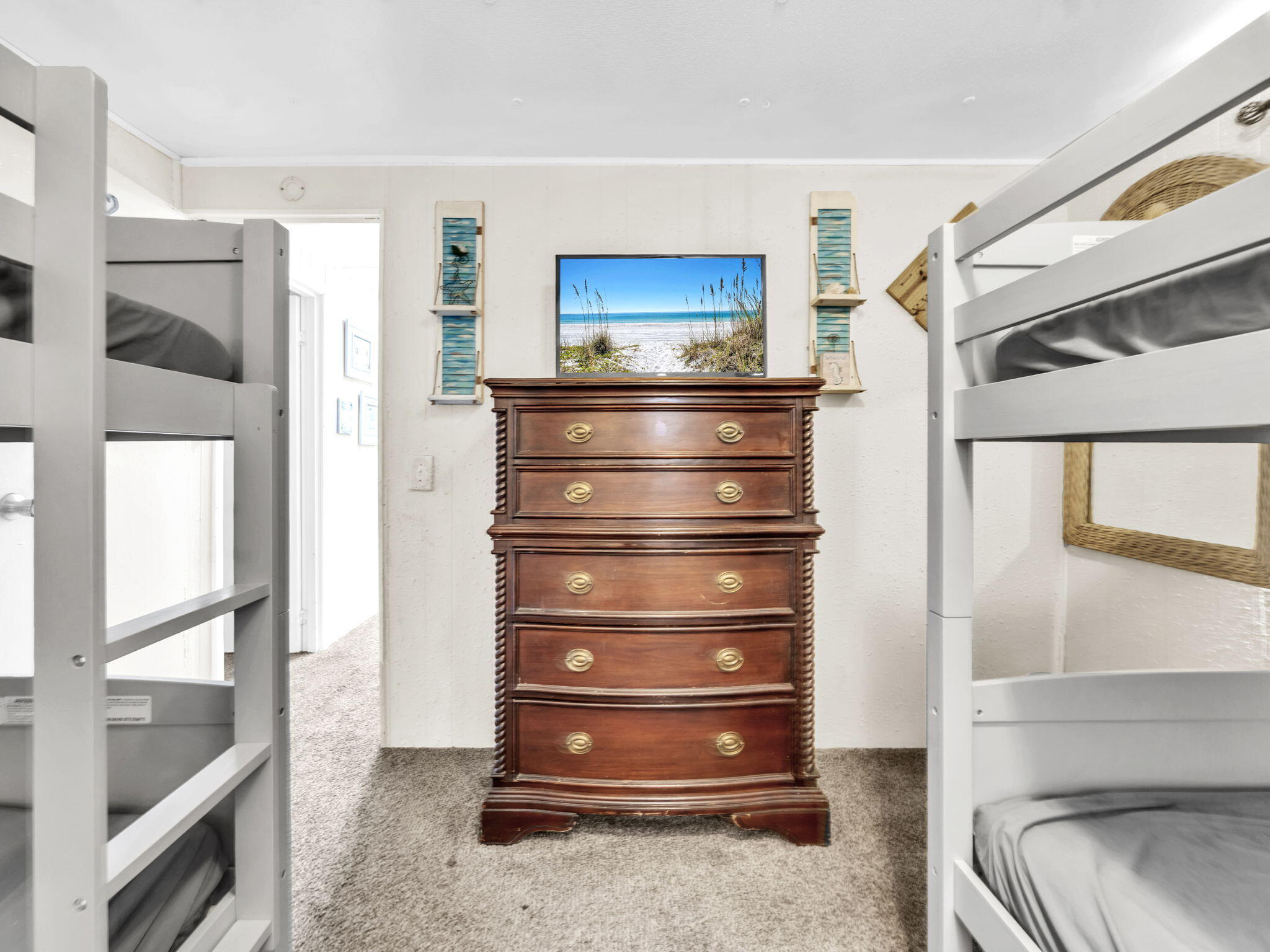 9028 Larker Woods Road Navarre, FL 32566 - Photo 27 of 36 a view of walk in closet with clothes and shoes