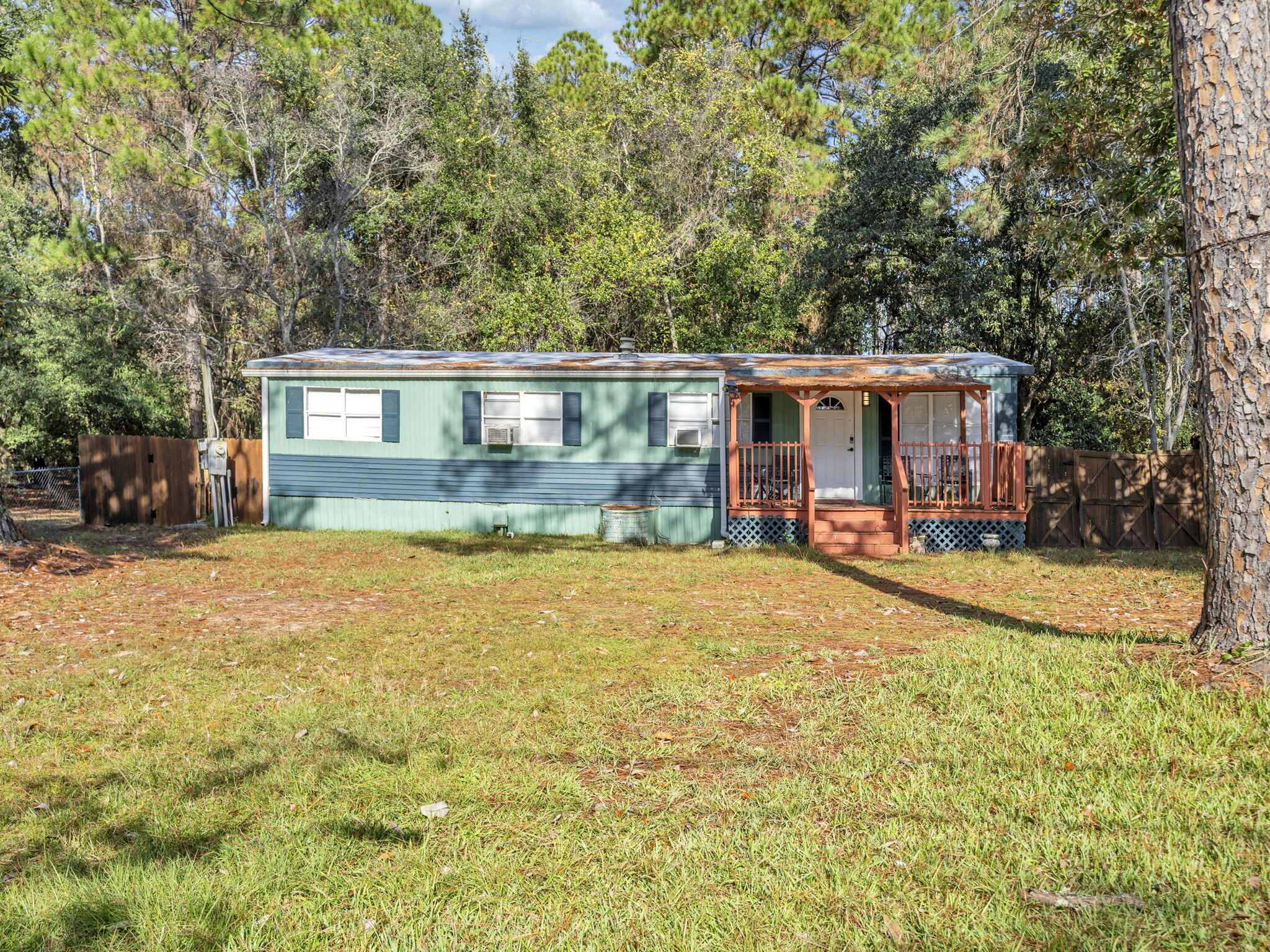 9028 Larker Woods Road Navarre, FL 32566 - Photo 28 of 36 a view of house with a swimming pool