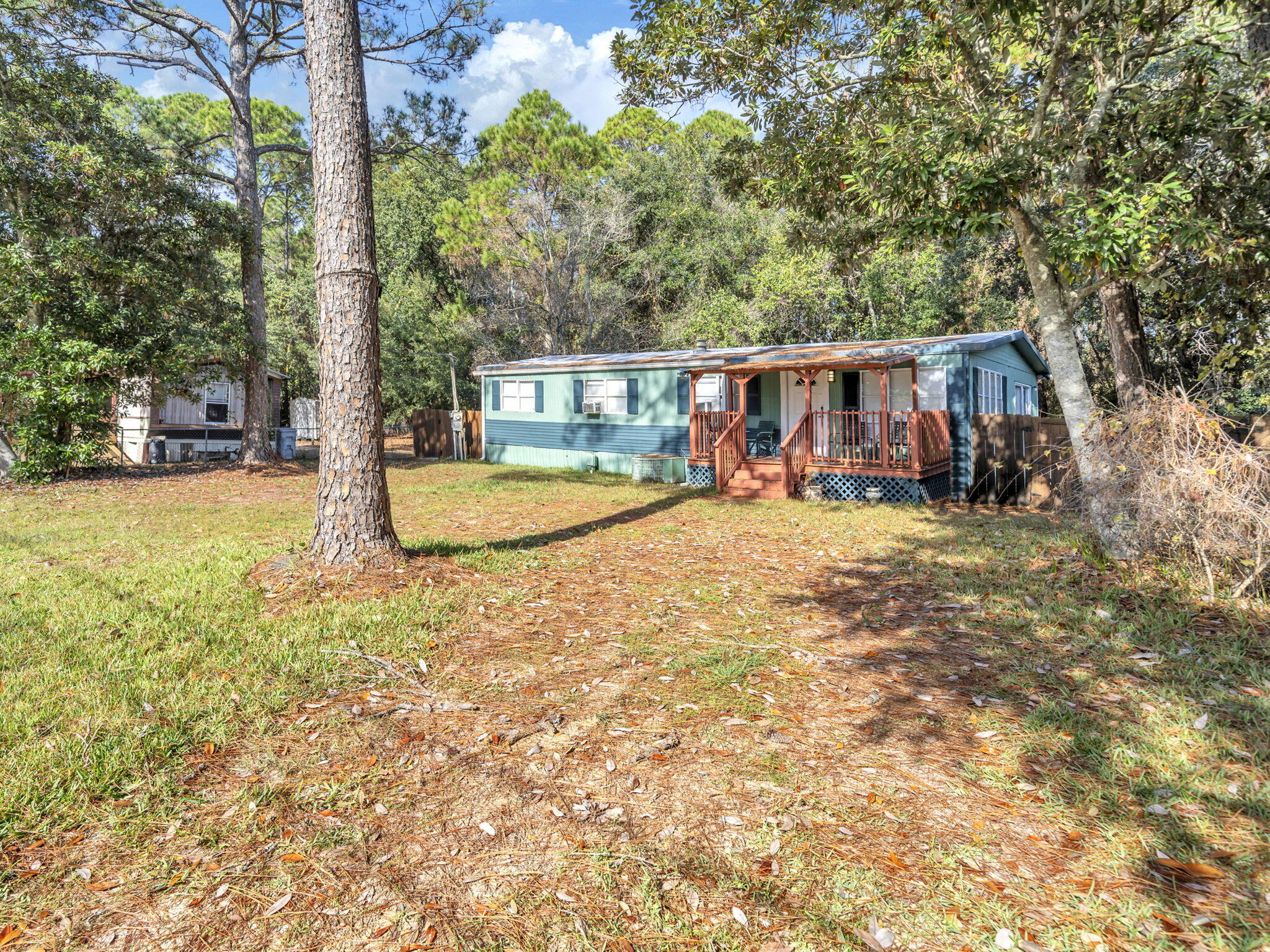9028 Larker Woods Road Navarre, FL 32566 - Photo 29 of 36 a view of a backyard