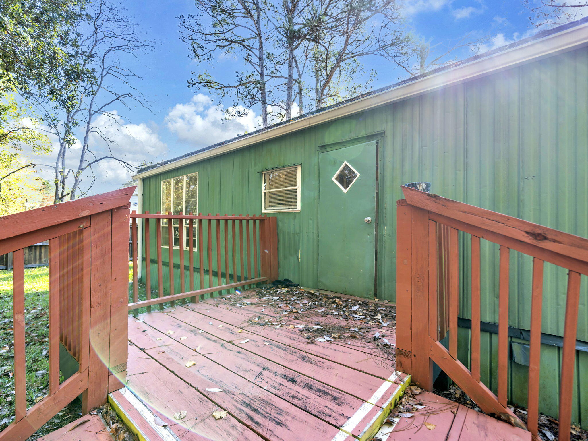 9028 Larker Woods Road Navarre, FL 32566 - Photo 30 of 36 a view of a backyard with pathway