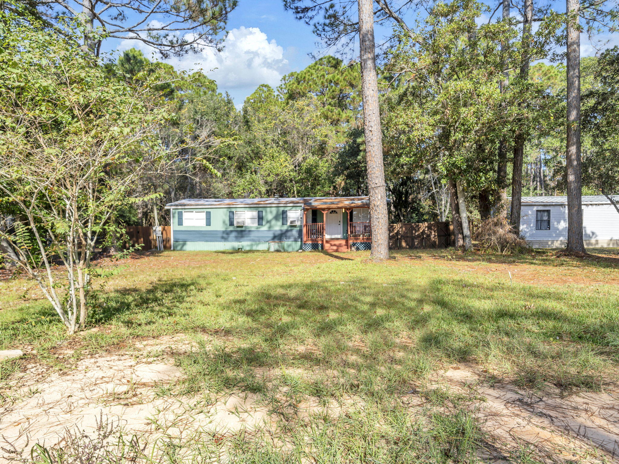 9028 Larker Woods Road Navarre, FL 32566 - Photo 33 of 36 a view of house with outdoor space