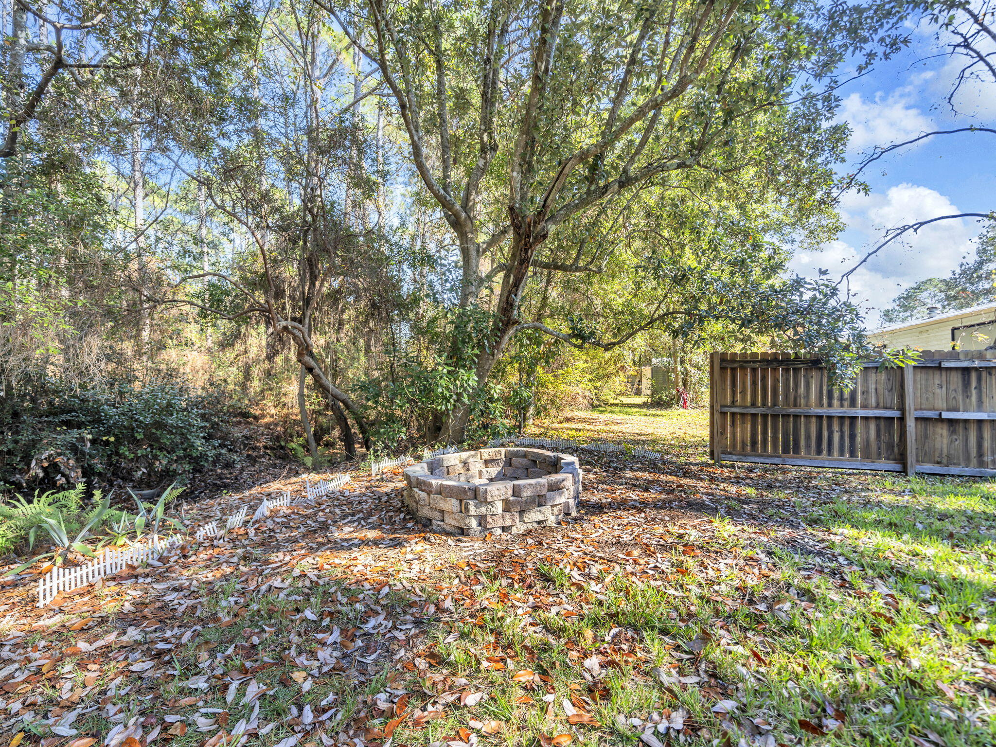 9028 Larker Woods Road Navarre, FL 32566 - Photo 35 of 36 a garden view