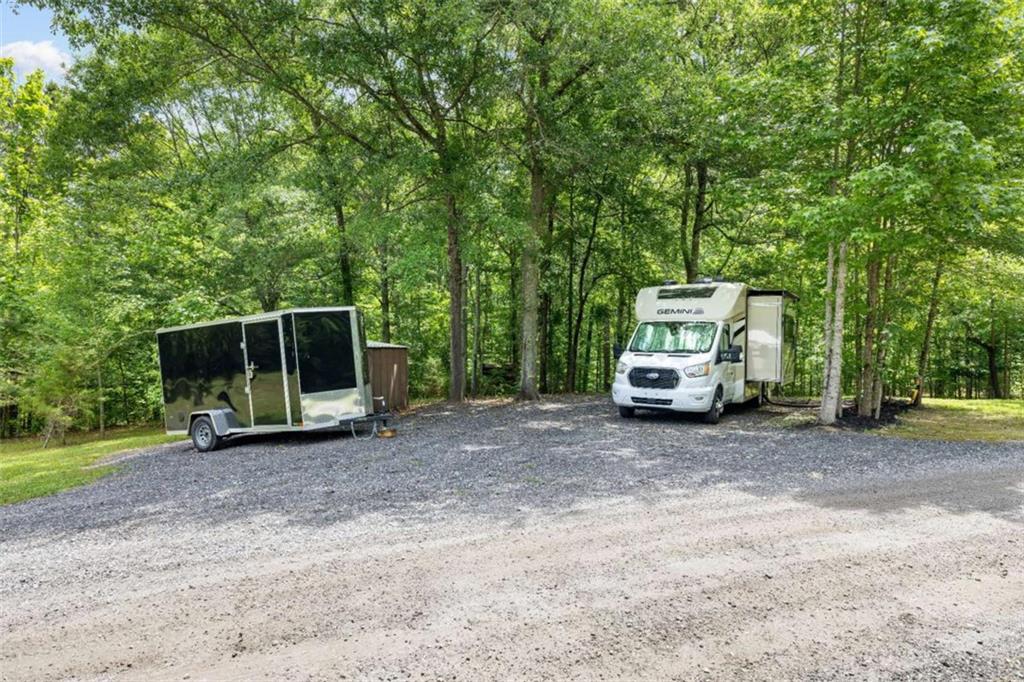 128 Byrom Road Senoia, GA 30276 - Photo 77 of 83 a view of a house with truck parked on a road