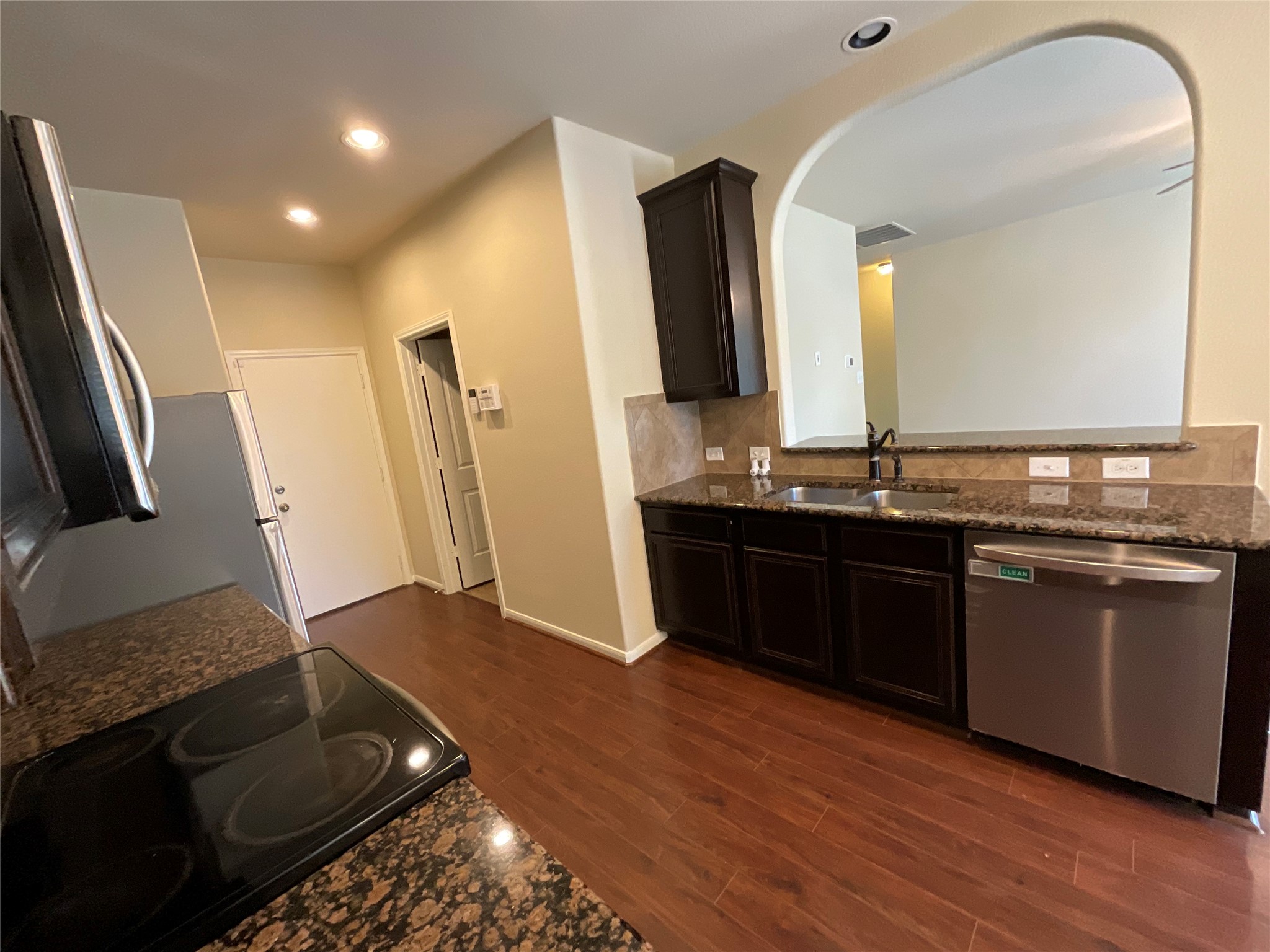 1911 Conn Creek Road Cedar Park, TX 78613 - Photo 18 of 39 a kitchen with a sink and a refrigerator
