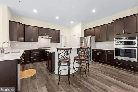 a view of a dining room with furniture and a wooden floor