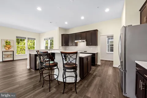 a kitchen with a stove and a sink