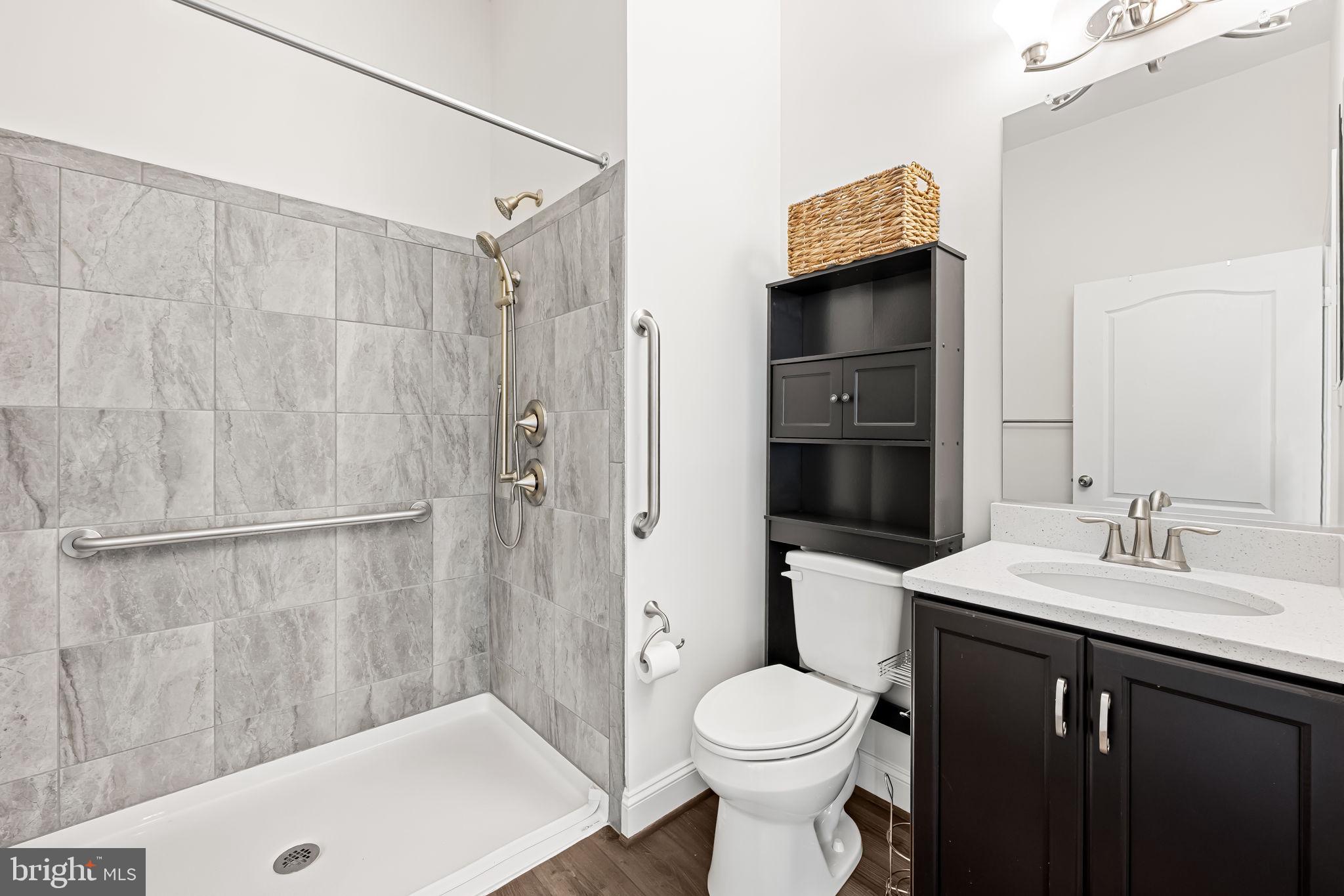 6352 Islington Street Middle River, MD 21220 - Photo 24 of 58 a bathroom with a sink a toilet and shower