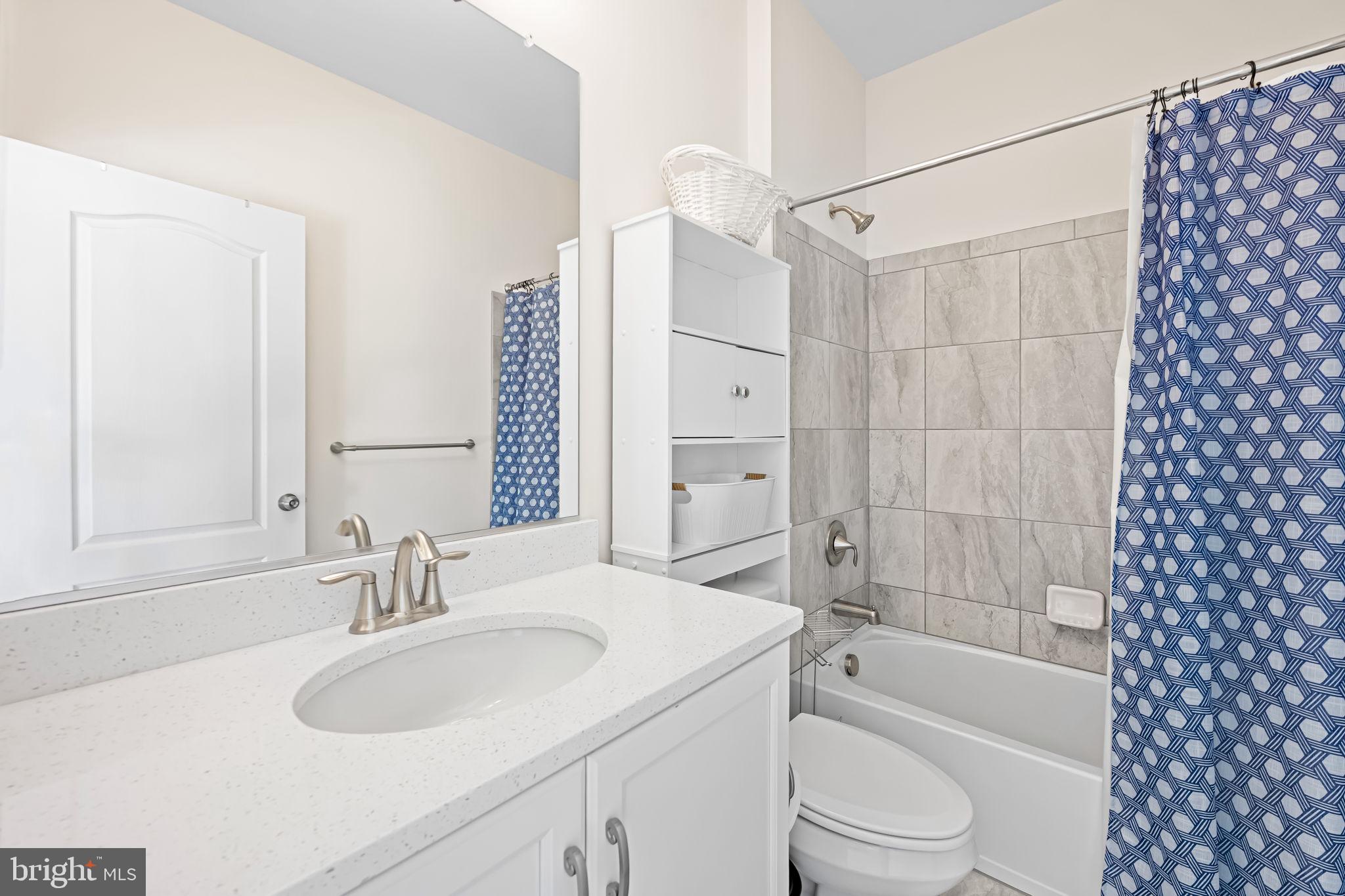 6352 Islington Street Middle River, MD 21220 - Photo 35 of 58 a bathroom with a sink toilet and shower