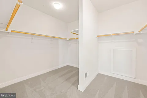 a front view of a house with swimming pool having outdoor seating