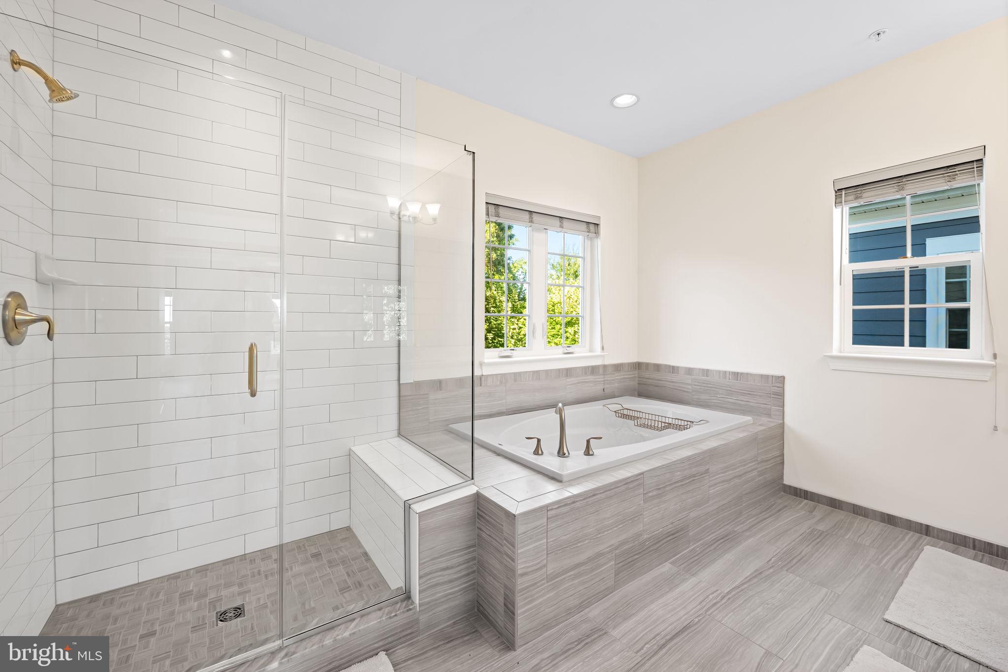 6352 Islington Street Middle River, MD 21220 - Photo 42 of 58 a bathroom with a tub a sink and a shower