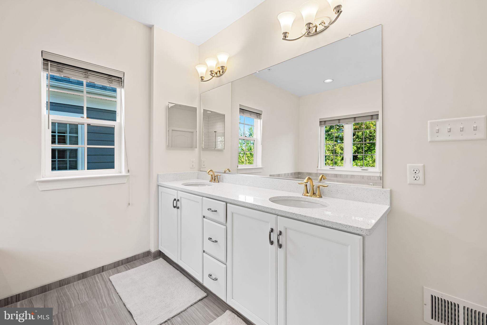 6352 Islington Street Middle River, MD 21220 - Photo 43 of 58 a bathroom with a sink double vanity and a mirror