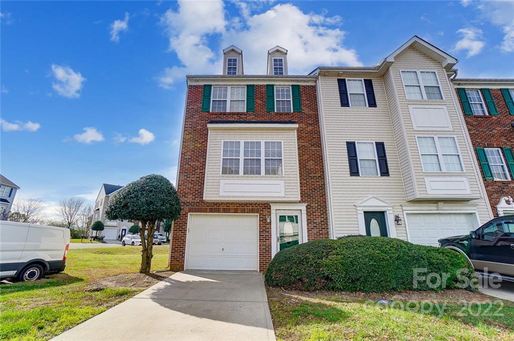 144 Rock Ridge Lane Mount Holly, NC 28120 - Photo 1 of 48 a front view of a house with garden