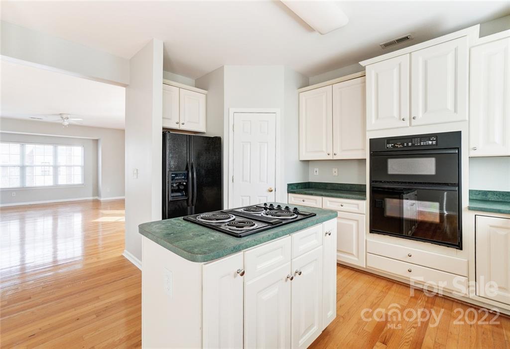 144 Rock Ridge Lane Mount Holly, NC 28120 - Photo 13 of 48 a kitchen with granite countertop a stove and a refrigerator