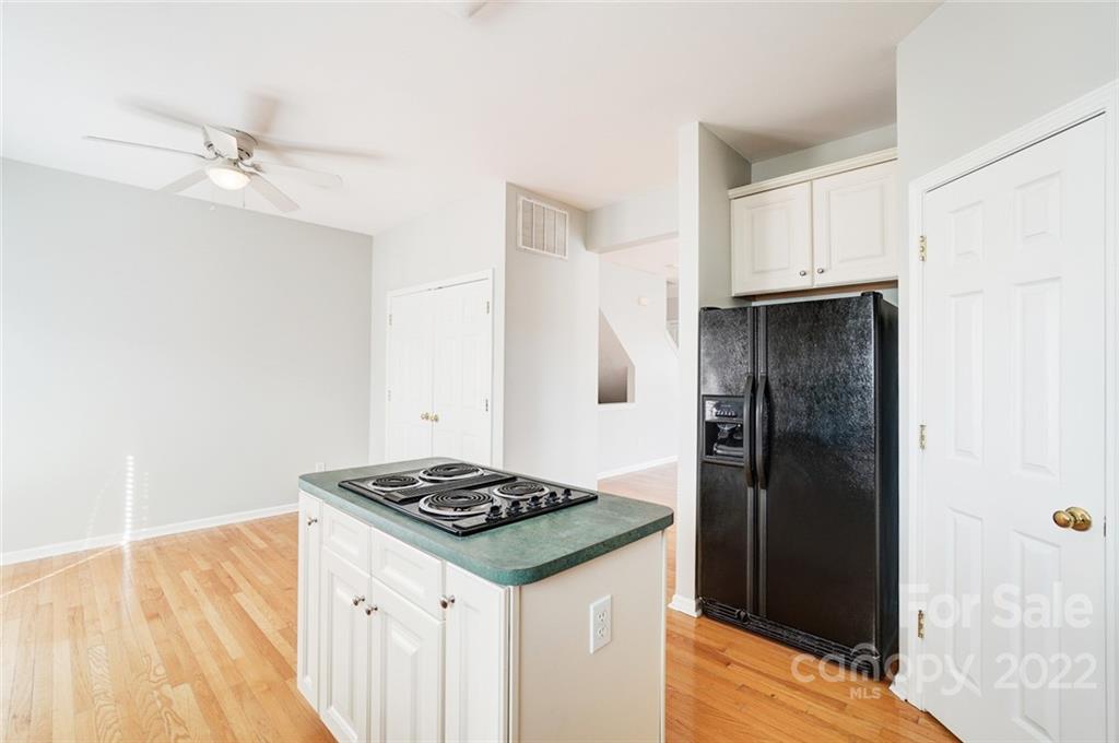 144 Rock Ridge Lane Mount Holly, NC 28120 - Photo 14 of 48 a kitchen with a refrigerator and a stove