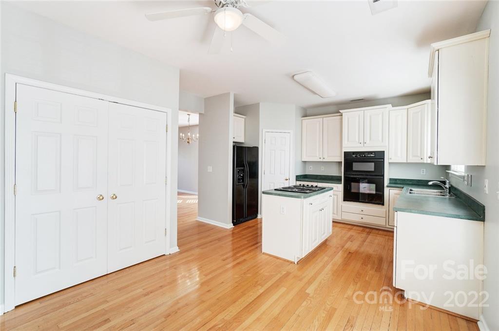 144 Rock Ridge Lane Mount Holly, NC 28120 - Photo 16 of 48 a kitchen with a refrigerator and a stove top oven